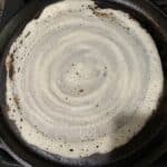 Not so perfect dosa on scrubbed pan.