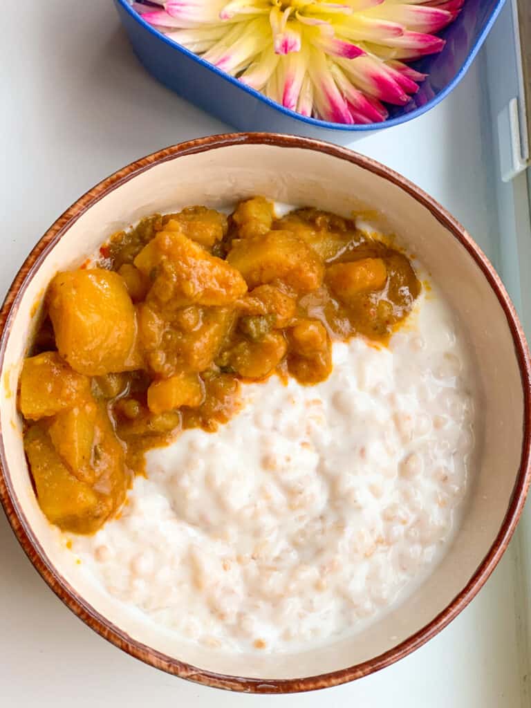 Steel cut oatmeal with yogurt and potato curry.