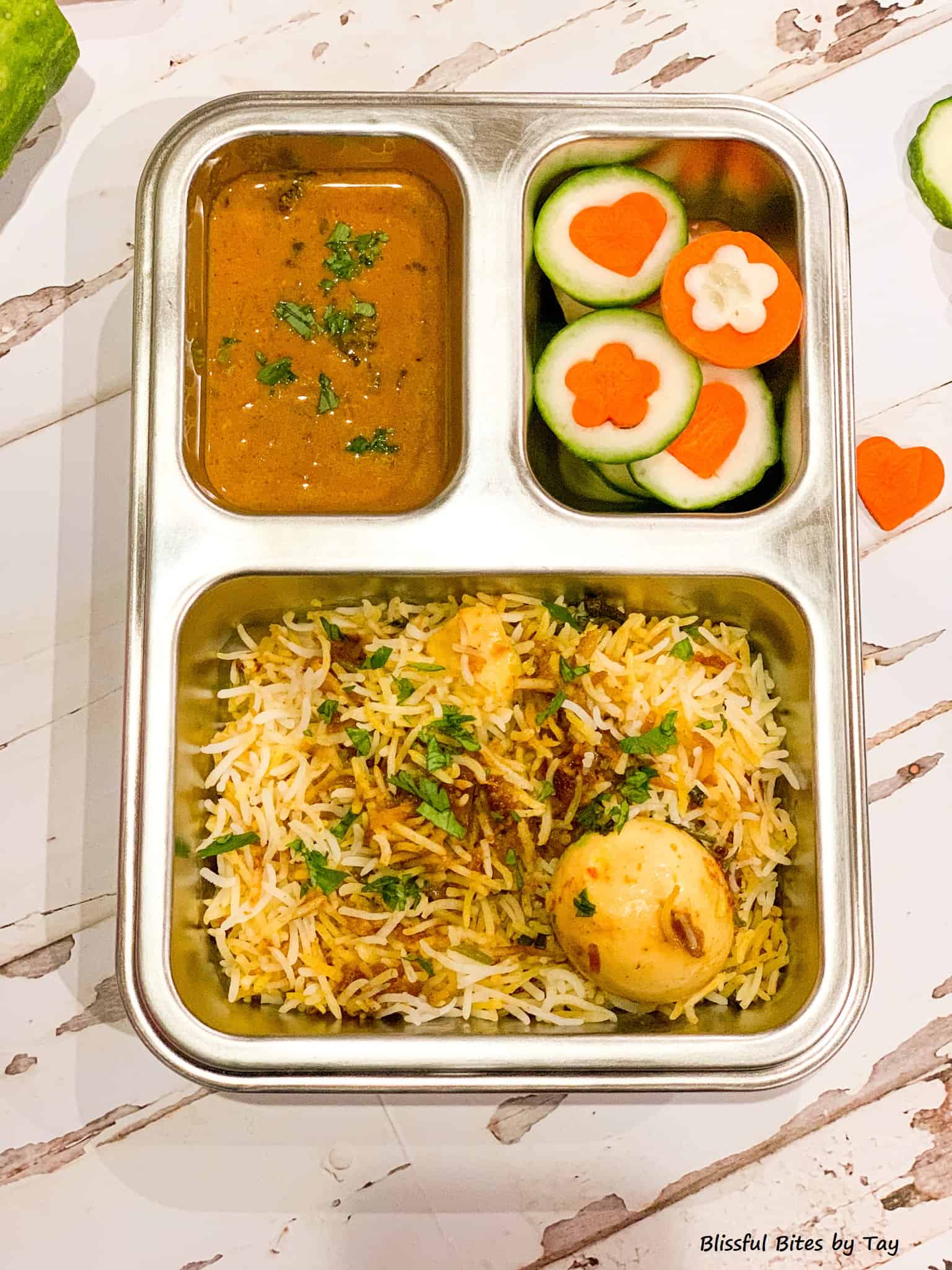 Lunchbox Idea: Egg Biryani, Mirchi ka salan and Veggie Shapes
