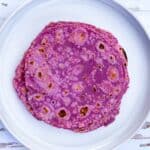 A stack of purple sweet potato rotis.