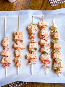 Tofu tikka skewered and ready to be baked.